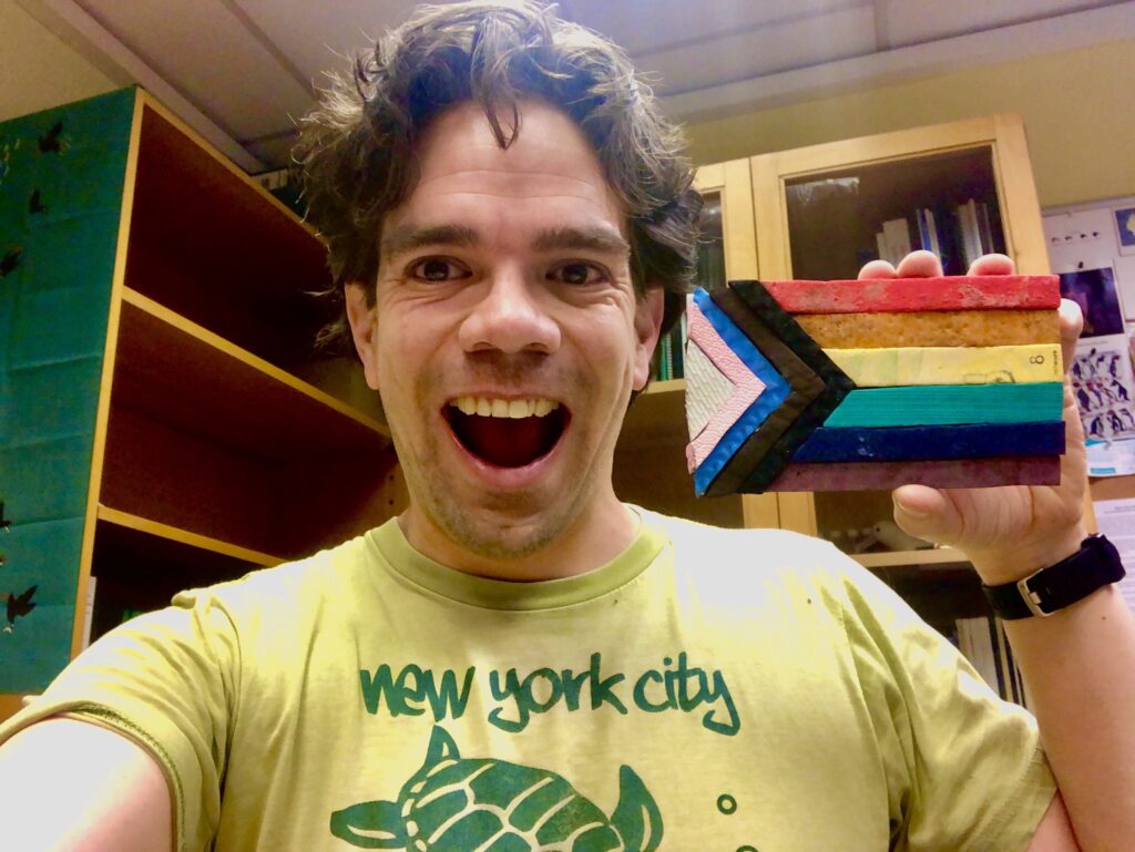 Alex is thrilled to receive the flag in the UK Alex Flag