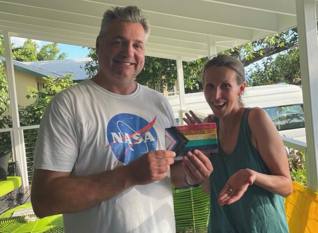 Kevin and Jennifer on Cocos, with the flag Kev